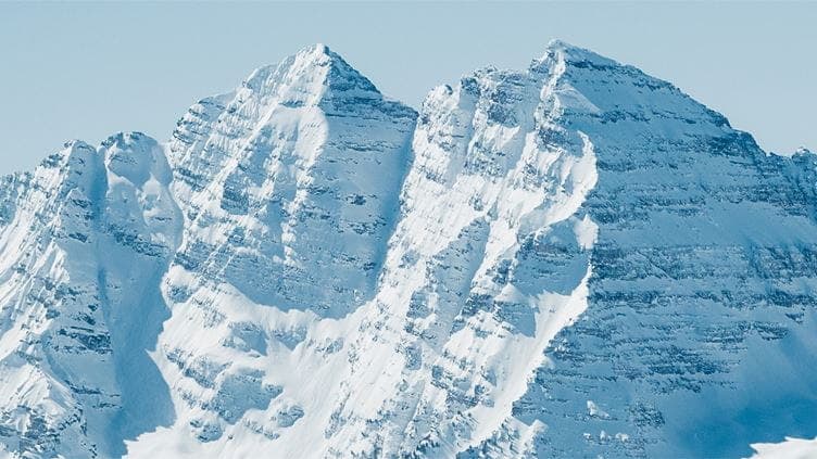 White snowy peaks of the Maroon Bells, on a bluebird winter day